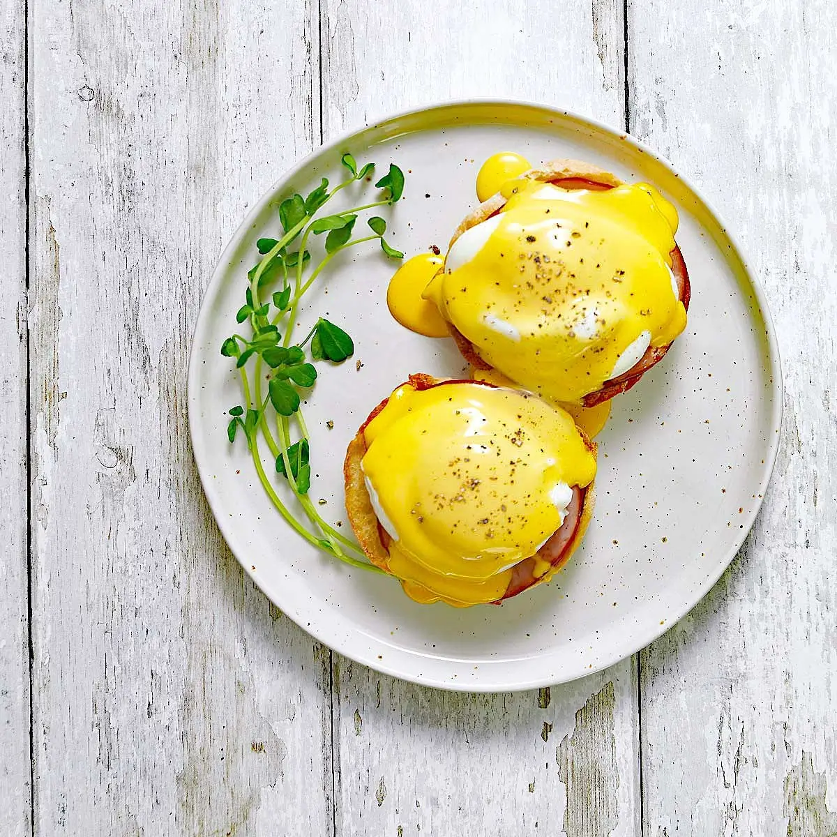 Eggs Benedict style breakfast served on a white plate